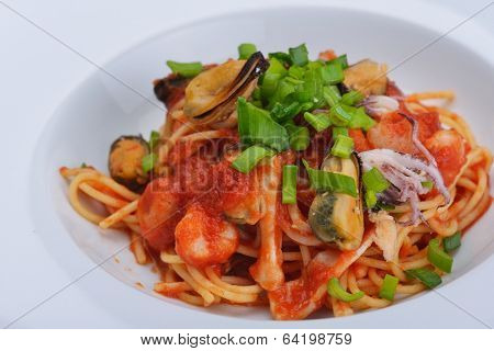 Pasta with shrimps, herbs and mashrooms isolated on white background in studio