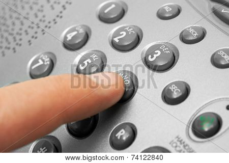 Finger and phone keypad, business background