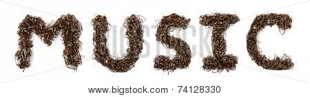 Word Music made of magnetic tape isolated on white background