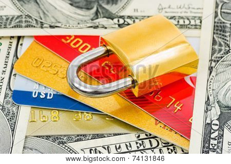 Credit cards, money and lock - business security background