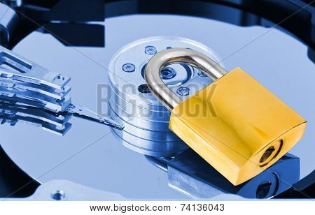 Computer harddrive and lock - security concept background