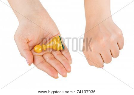 White chess pawn in hand isolated on white background