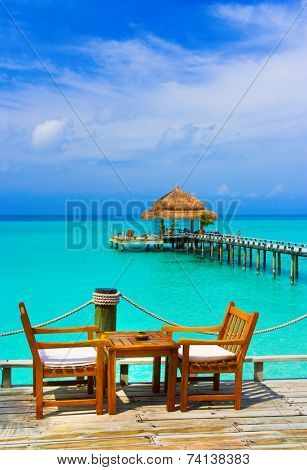 Cafe on the beach, ocean and sky
