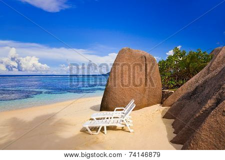 Chairs on tropical beach at Seychelles - vacation background