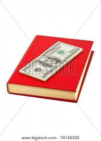 Money and book isolated on white background