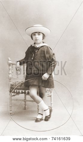 Ancient portrait of of girl in a studio. vintage