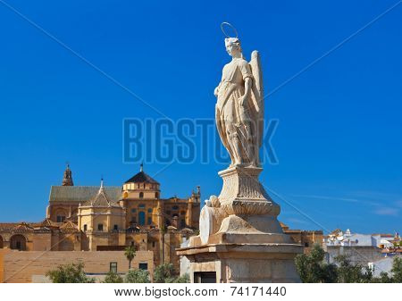 Archangel Raphael statue on bridge at Cordoba Spain - nature and architecture background