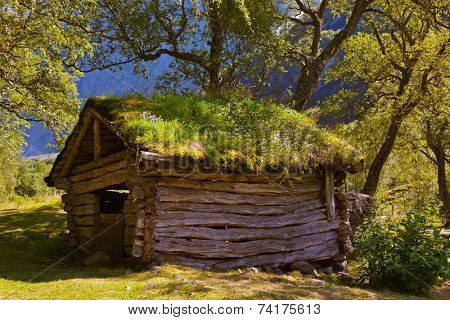 Old house near Briksdal glacier - nature and travel background