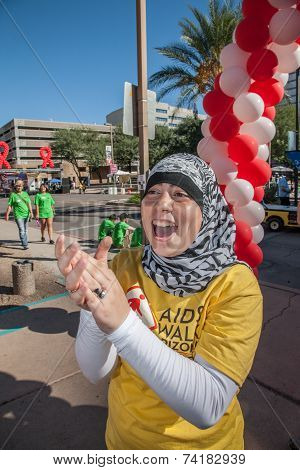 Woman Encouraging Participants At Aidswalk