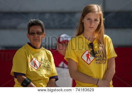 Emotional Young Woman Viewing Section Of The Aids Quilt