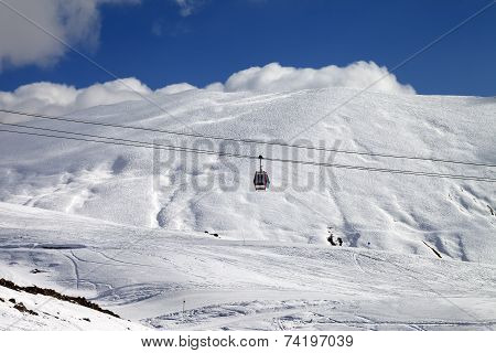Gondola Lift And Ski Slope At Sun Day