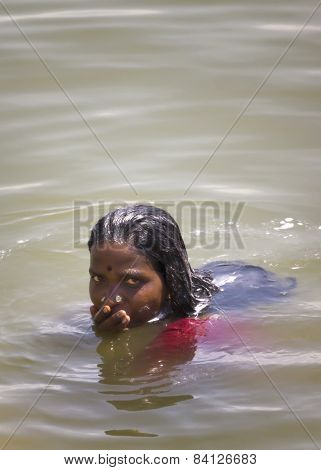 Young Woman Rises Out Of The Water.