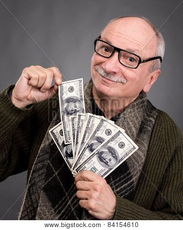 Lucky Elderly Man Holding Dollar Bills