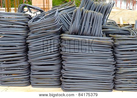 Concrete rebar cut bent and bundled for construction.