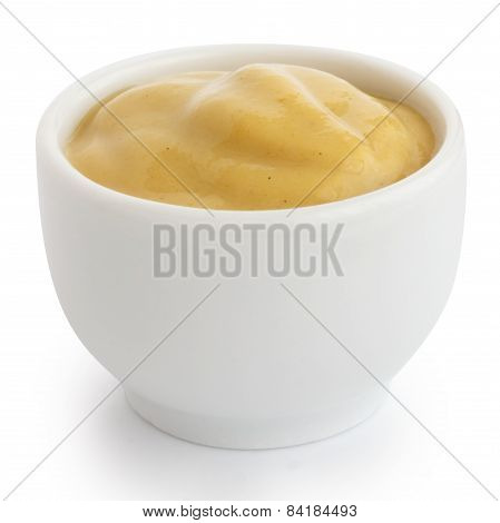 Smooth mustard in white ceramic ramekin.