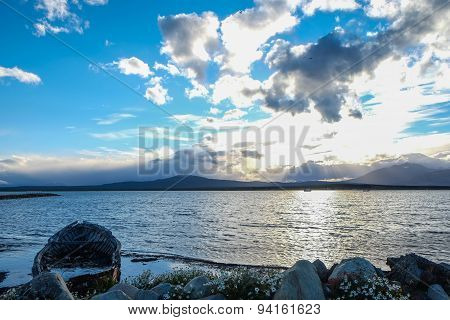 Partially Submerged Boat at Sunset