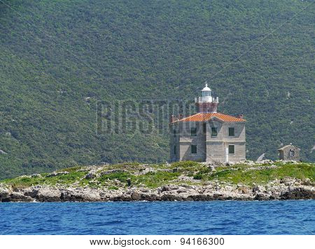A ligthouse on a island in the Mediterranean