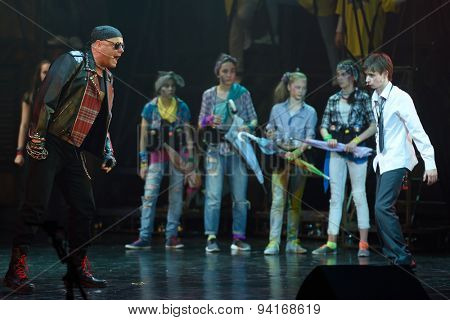 ST. PETERSBURG, RUSSIA - JUNE 19, 2015: Singer Alexey Kortnev performs in a scene from a children's charity project titled Mowgli Generation. The performance is part of the SPIEF 2015