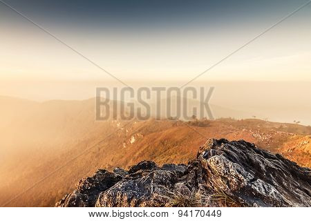Sunrise scene with the peak of mountain and cloudscape