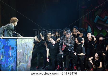 ST. PETERSBURG, RUSSIA - JUNE 19, 2015: Singer Alexey Kortnev performs in a scene from a children's charity project titled Mowgli Generation. The performance is part of the SPIEF 2015