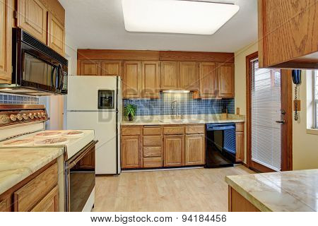 Simple Kitchen With Hardwood Floor.