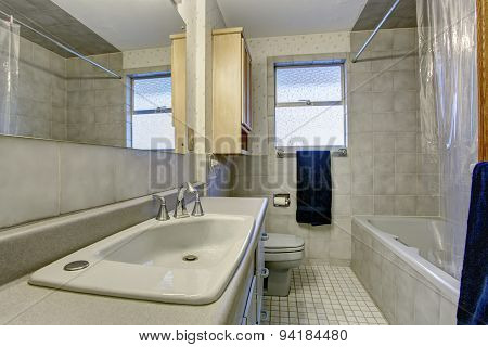 Simple bathroom with tile floors.