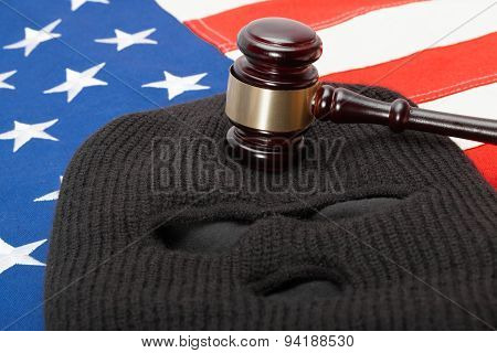 Thief Mask And Judge Gavel Over Us Flag - Studio Shot