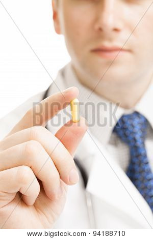 Doctor Holdling Pills With Two Fingers - Heath Care Concept