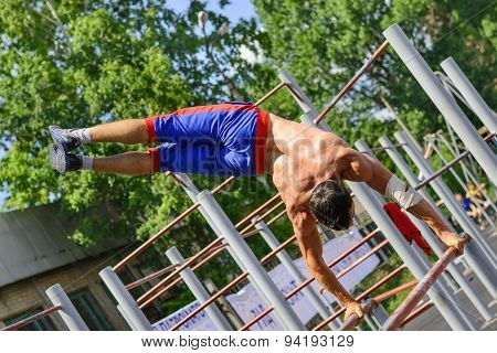 Unidentified Sportsman Performs Acrobatic Element During The Street Workout Championship At Krivoy R