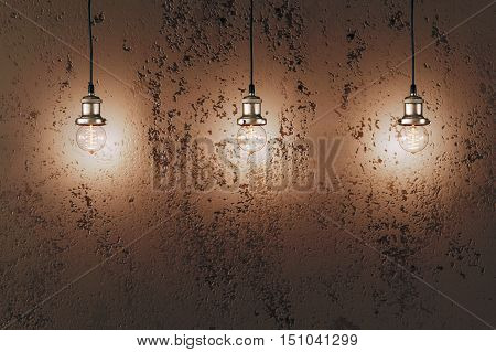 Industrial pendant lamps against rough wall. Loft interior. Edison bulbs.