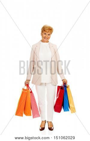 Happy business woman holging shopping bags