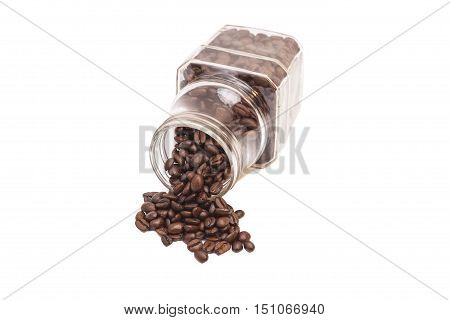 Coffee beans spilling out of a cristal jar on white background