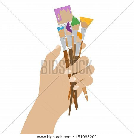 Hand holding paint brushes. set of brushes in different styles