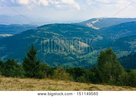 Carpathian Mountains in Summer. Beautiful nature landscape with mountains, trees and blue sky with clouds