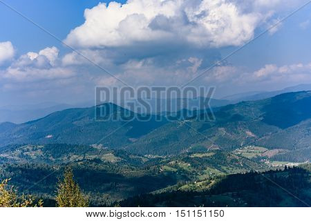 Carpathian Mountains in Summer. Beautiful nature landscape with mountains, trees and blue sky with clouds