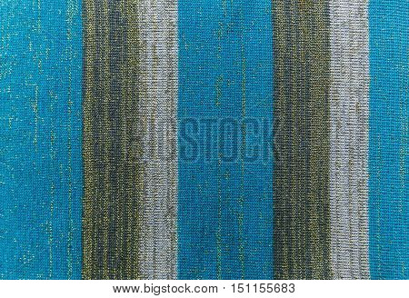 Knitted stripe fabric blue striped background.Knited texture.Manufacture.