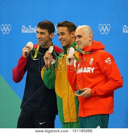 RIO DE JANEIRO, BRAZIL - AUGUST 12, 2016: Silver medalists Michael Phelps USA (L), Laszlo Cseh HUN and Chad le Clos RSA during medal ceremony after Men's 100m butterfly of the Rio 2016 Olympics
