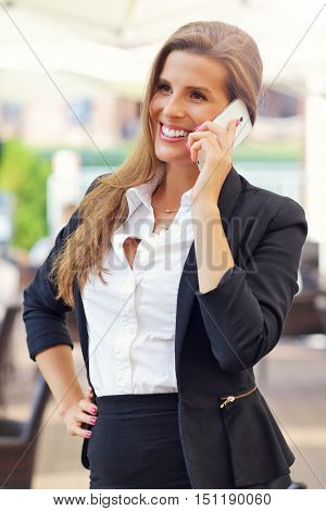 Picture of young businesswoman working cafe