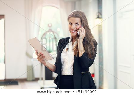 Picture of young businesswoman working in lobby