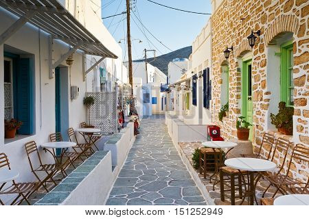 FOLEGANDROS, GREECE - SEPTEMBER 24, 2016: Coffee shop and shops in a street of Folegandros village on September 24.