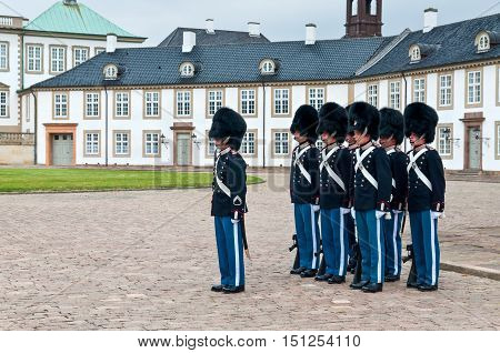 Fredensborg Denmark - August 6 2010: Royal guards changing on Fredensborg palace at August 6 2010 in Fredensborg Denmark.