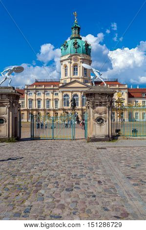 Berlin, Germany - April 2, 2008: Tourists Walk In Front Of The Palace Charlottenburg