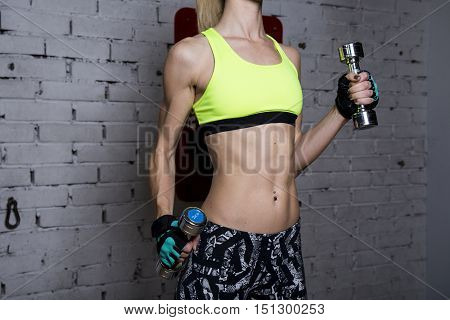 Young Woman Goes In For Sports At Gym