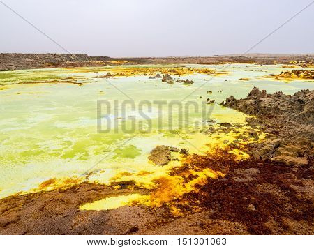 Sulphur lake Dallol in a volcanic explosion crater in the Danakil Depression northeast of the Erta Ale Range in Ethiopia. The lake with its sulphur springs is the hottest place on Earth.