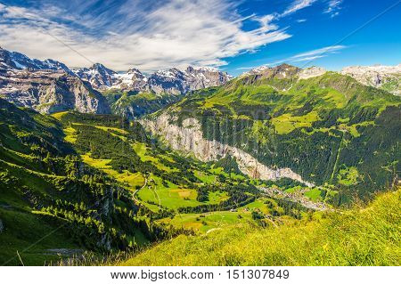 Famous Lauterbrunnen Valley With Gorgeous Waterfall And Swiss Alps In The Background From Mannlichen