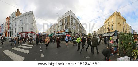 LONDON UNITED KINGDOM - NOVEMBER 23: Portobello Road Market Crowded With Tourists in London on NOVEMBER 23 2013. Portobello Road Market With Shoppers on Saturday in London United Kingdom.