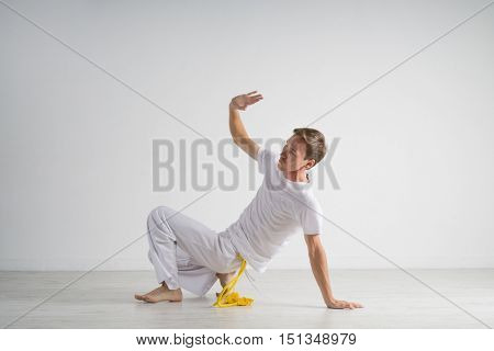 Man practicing capoeira , brazilian martial art.