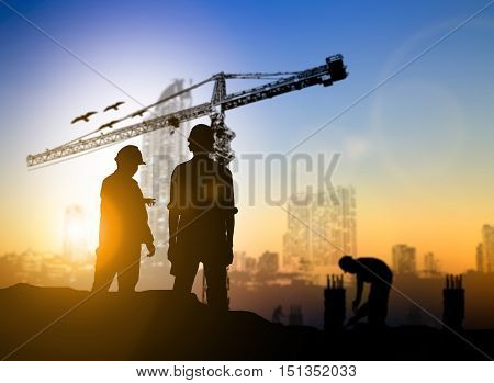 silhouette engineer construction site over Blurred construction worker on construction site