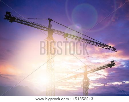 Silhouette construction site with crane over .