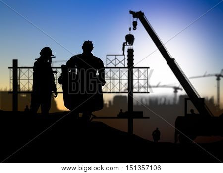 silhouette engineer looking construction worker in a building site over Blurred construction site